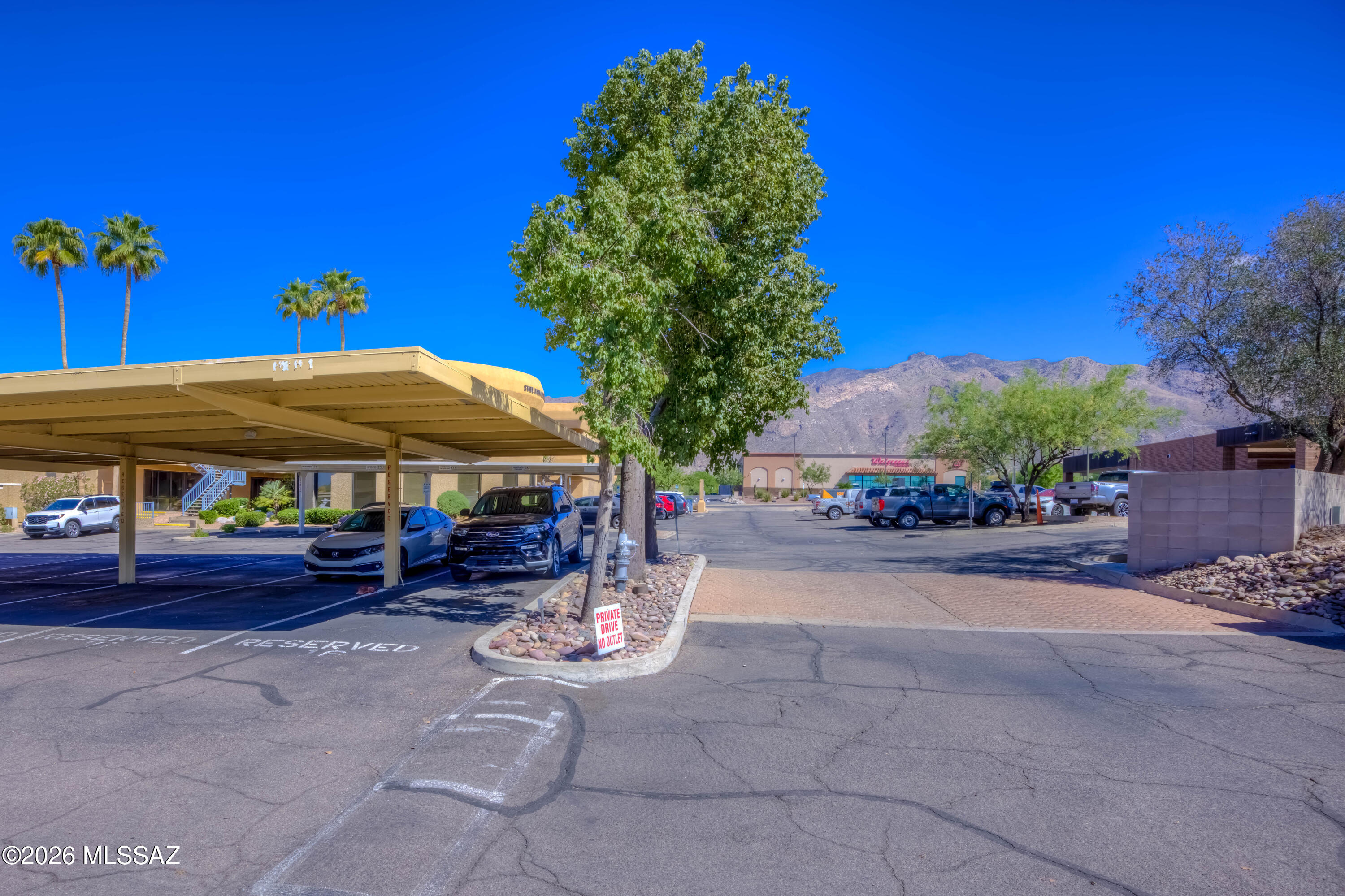 5500 North Valley View Road, Unit 123 Tucson, AZ 85718 - Photo 5 of 36 a couple of table and chairs under an umbrella