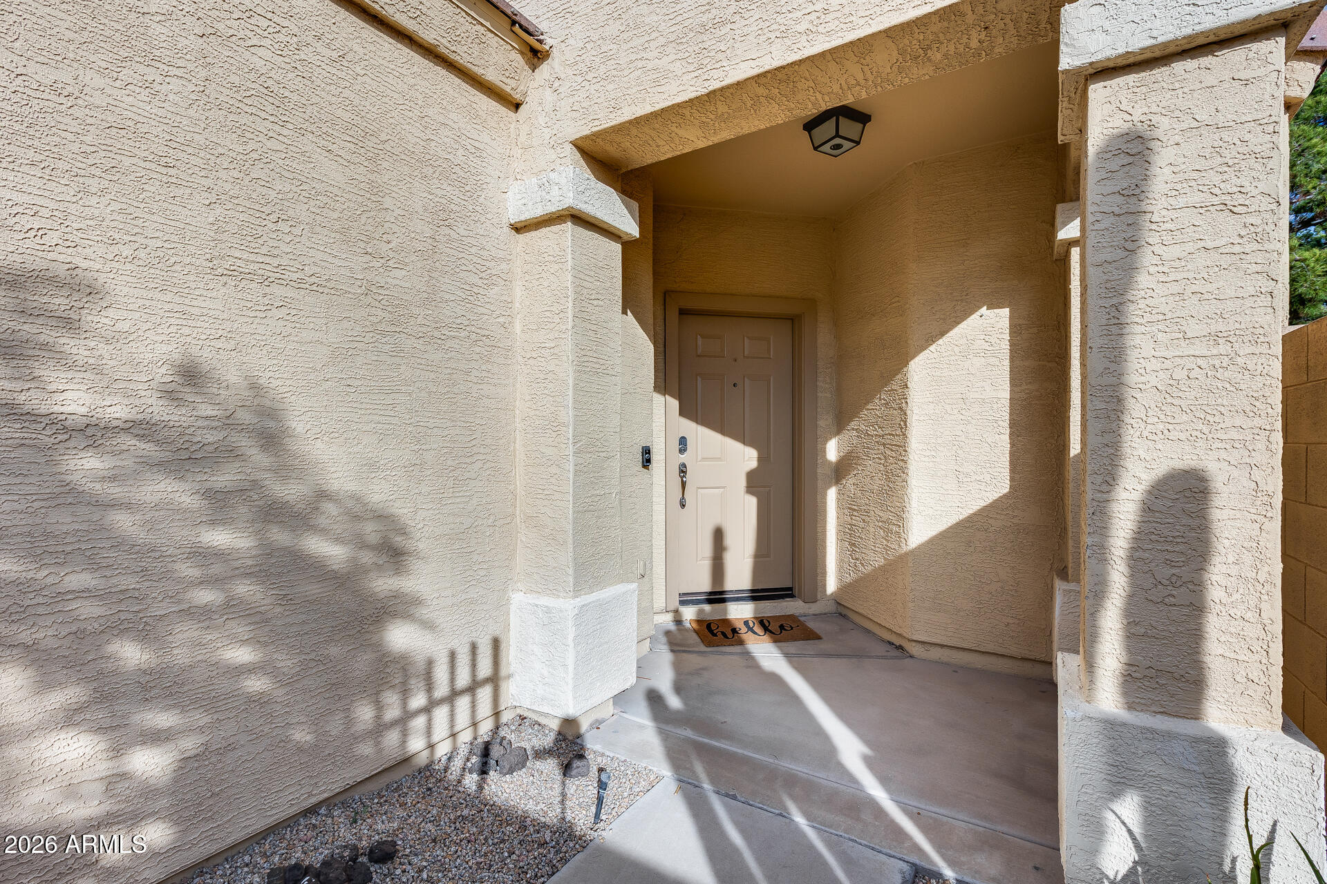 3252 East Fremont Road Phoenix, AZ 85042 - Photo 10 of 45 a view of a patio with white walls