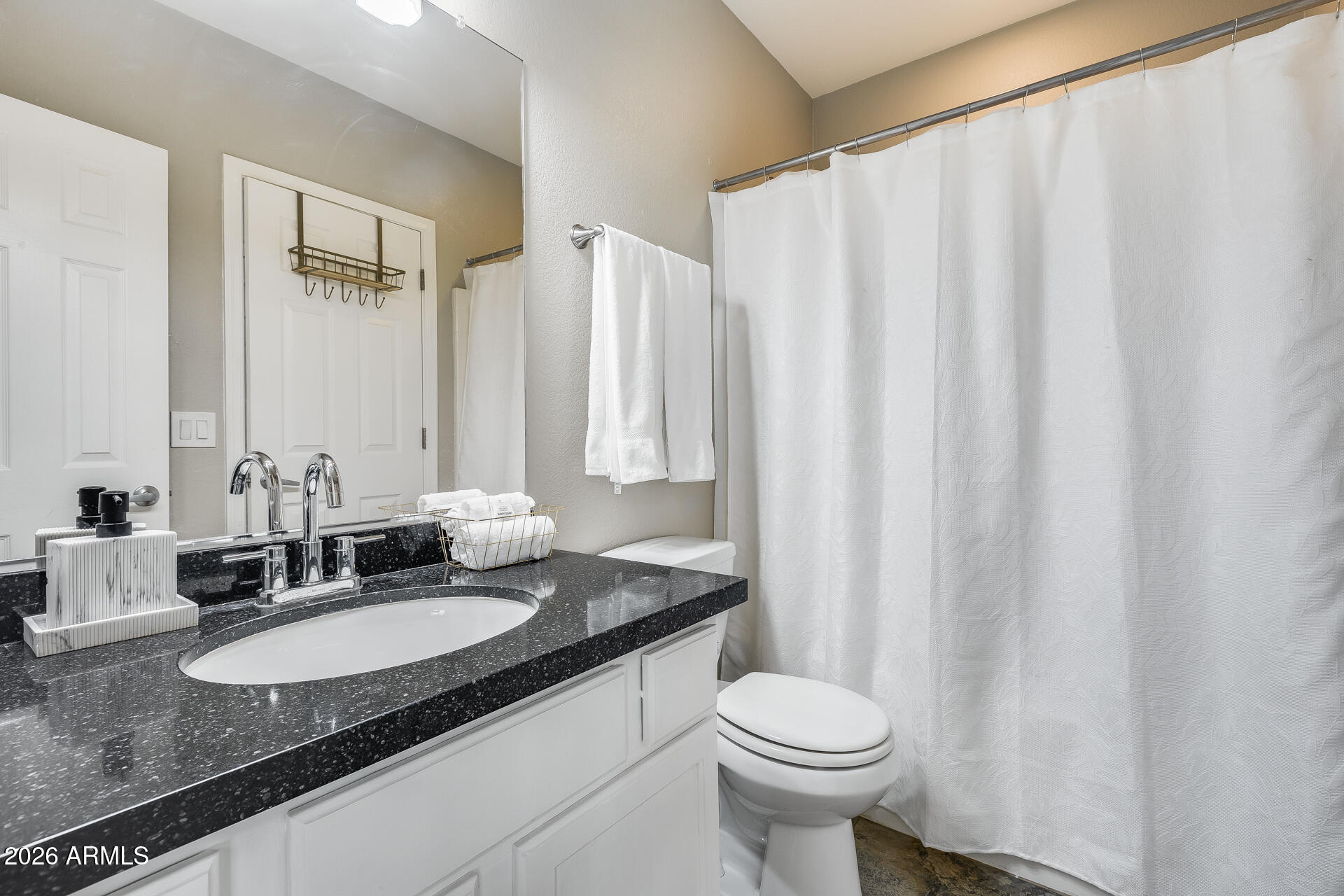 3252 East Fremont Road Phoenix, AZ 85042 - Photo 17 of 45 a bathroom with a granite countertop sink and a mirror