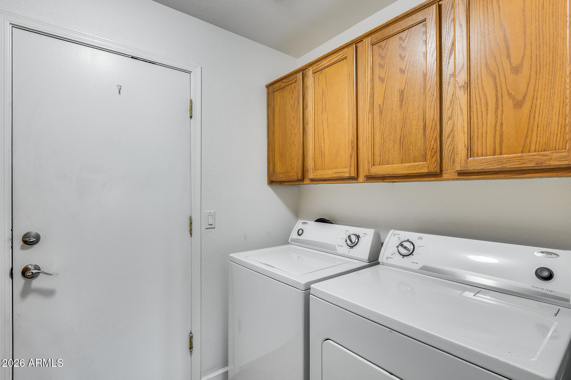 3252 East Fremont Road Phoenix, AZ 85042 - Photo 30 of 45 a view of storage and utility room with washer and dryer