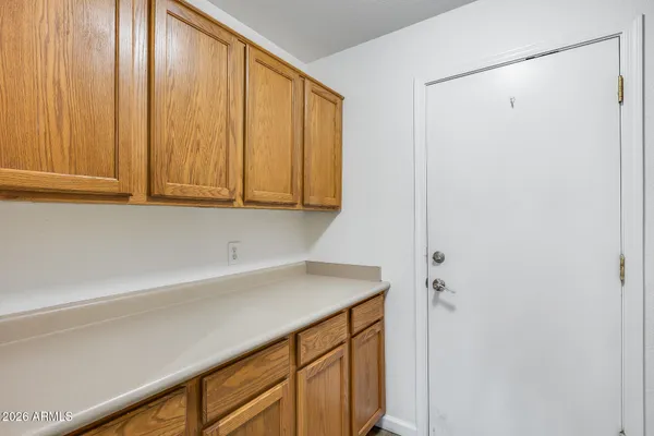 a view of storage and utility room with washer and dryer