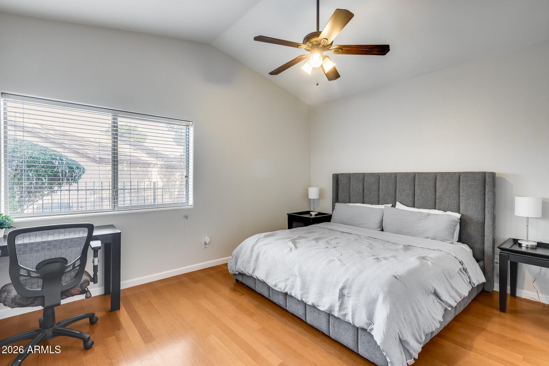 3252 East Fremont Road Phoenix, AZ 85042 - Photo 32 of 45 a bedroom with a bed and a chandelier