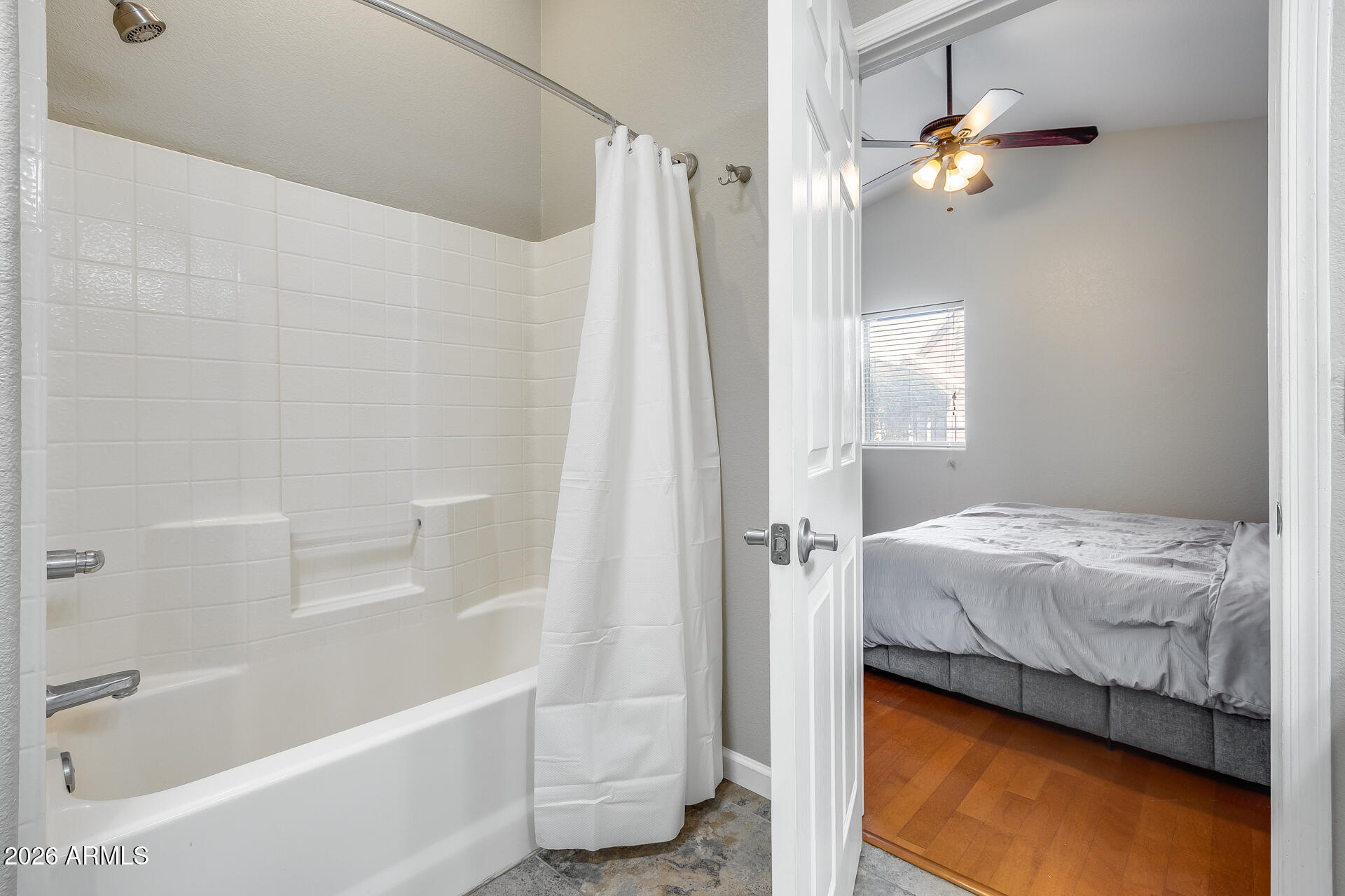 3252 East Fremont Road Phoenix, AZ 85042 - Photo 36 of 45 a bathroom with a bathtub and a shower