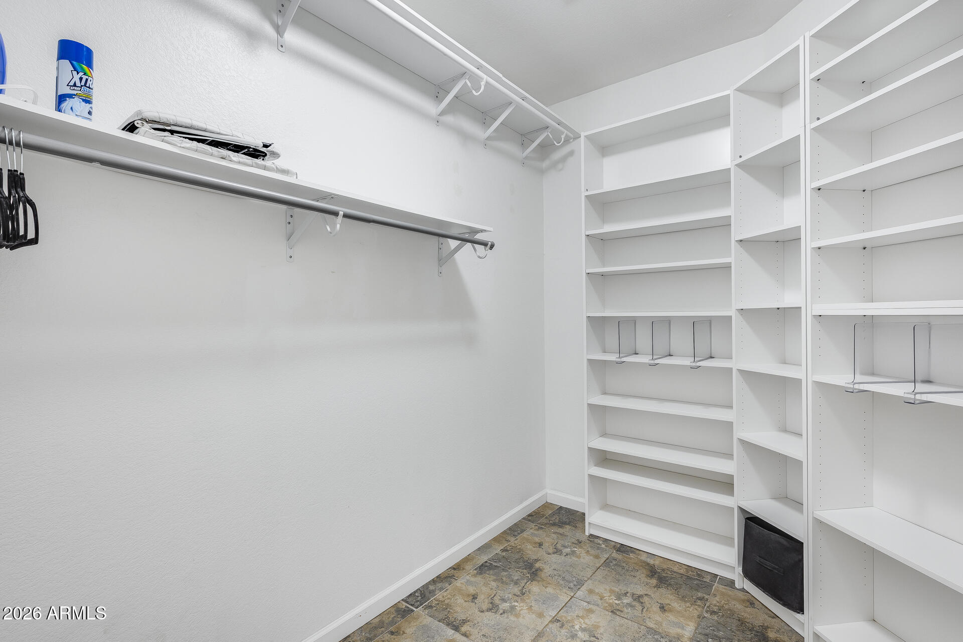 3252 East Fremont Road Phoenix, AZ 85042 - Photo 37 of 45 a view of walk in closet with empty racks