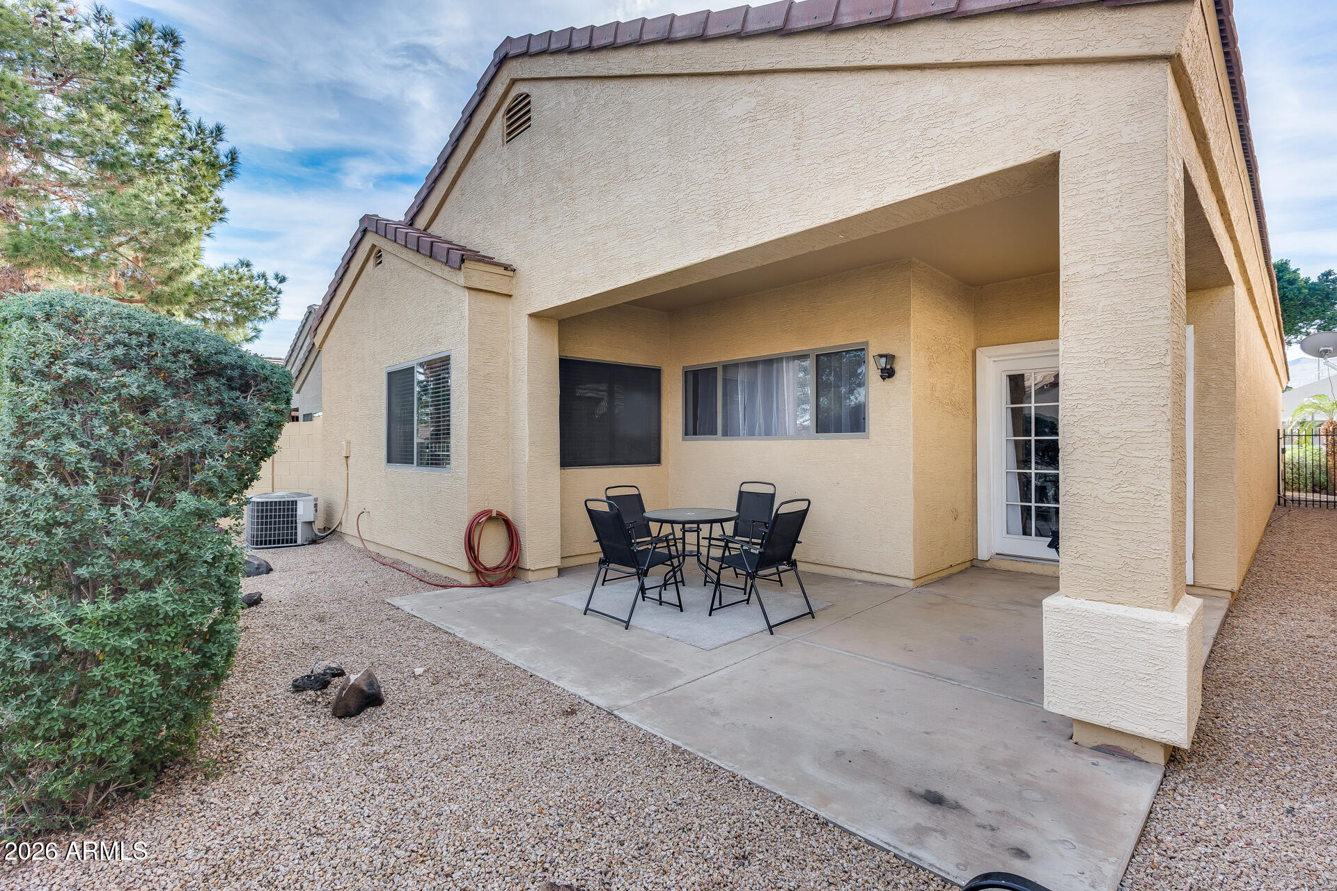 3252 East Fremont Road Phoenix, AZ 85042 - Photo 5 of 45 a view of a patio with table and chairs and potted plants