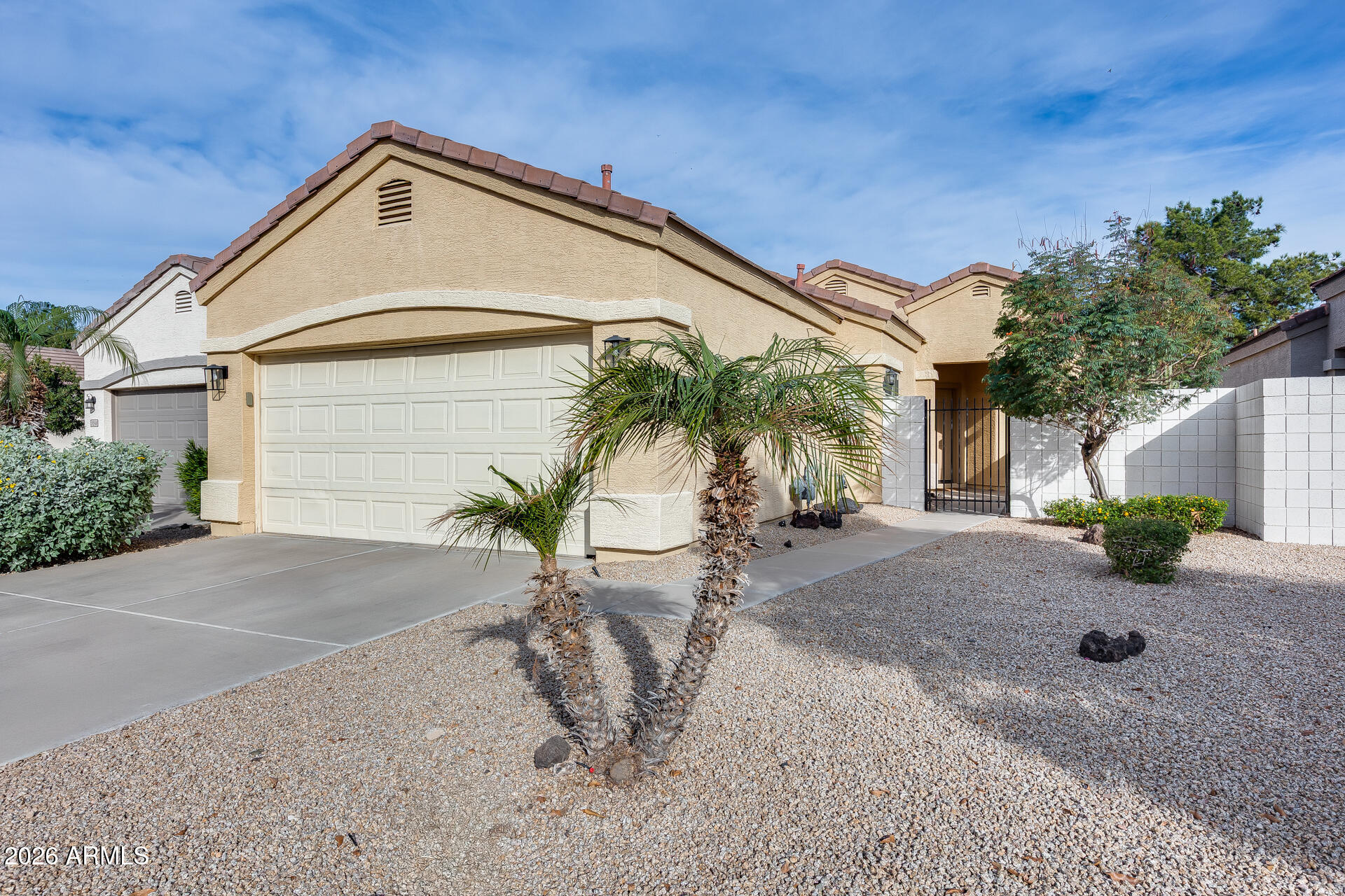 3252 East Fremont Road Phoenix, AZ 85042 - Photo 8 of 45 a front view of a house with a yard and garage
