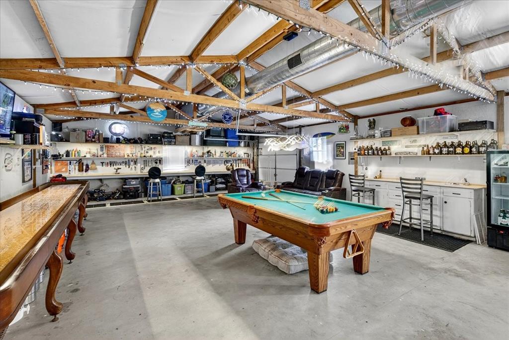 1 Wildflower Lane Athens, TX 75751 - Photo 22 of 23 a room with lots of wooden furniture with windows