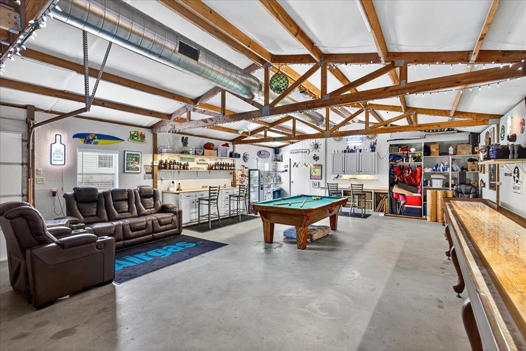 1 Wildflower Lane Athens, TX 75751 - Photo 23 of 23 a living room with furniture a flat screen tv and a table
