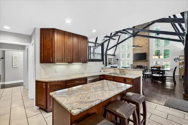 a kitchen with a table and chairs in it