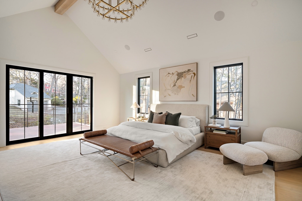 1301 Commonwealth Avenue Newton, MA 02465 - Photo 25 of 42 a spacious bedroom with a bed and a large window