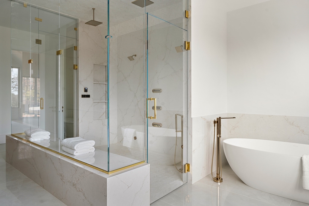 1301 Commonwealth Avenue Newton, MA 02465 - Photo 29 of 42 a bathroom with a bathtub and shower