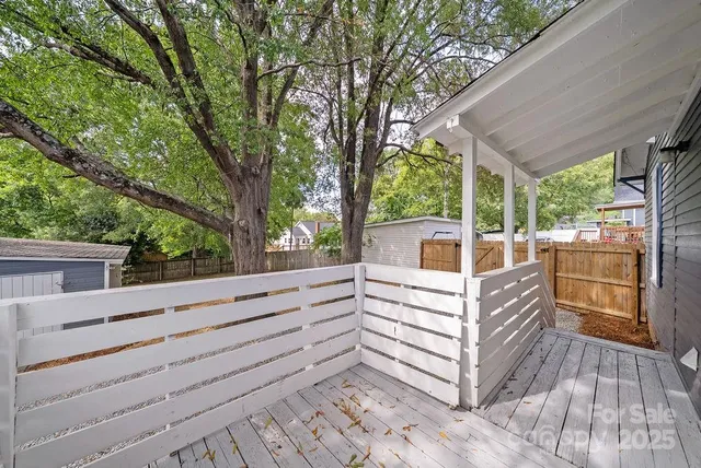 a view of a two chairs and table in the balcony