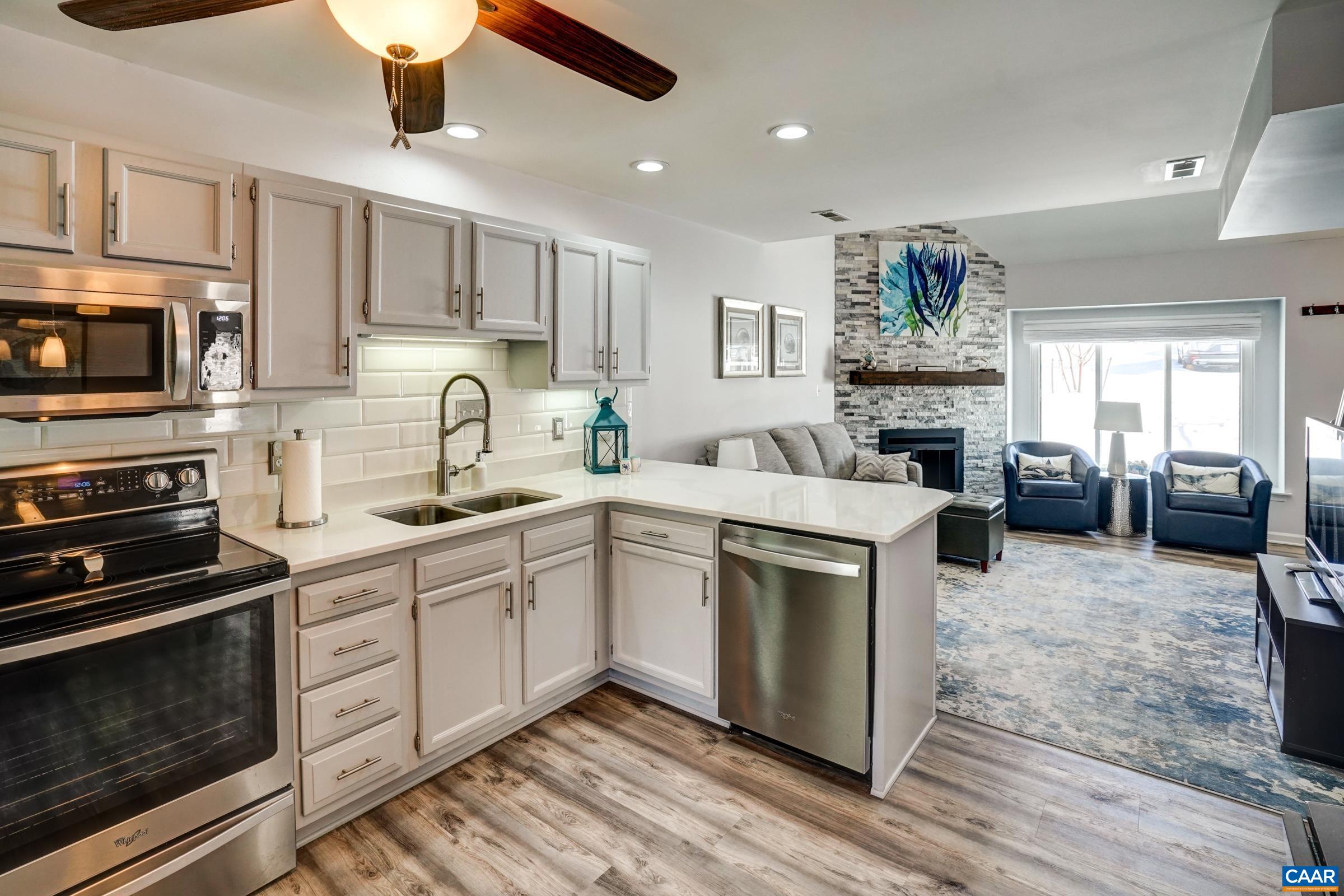 1008 Highlands Drive Charlottesville, VA 22901 - Photo 12 of 41 a kitchen with a sink stove and microwave