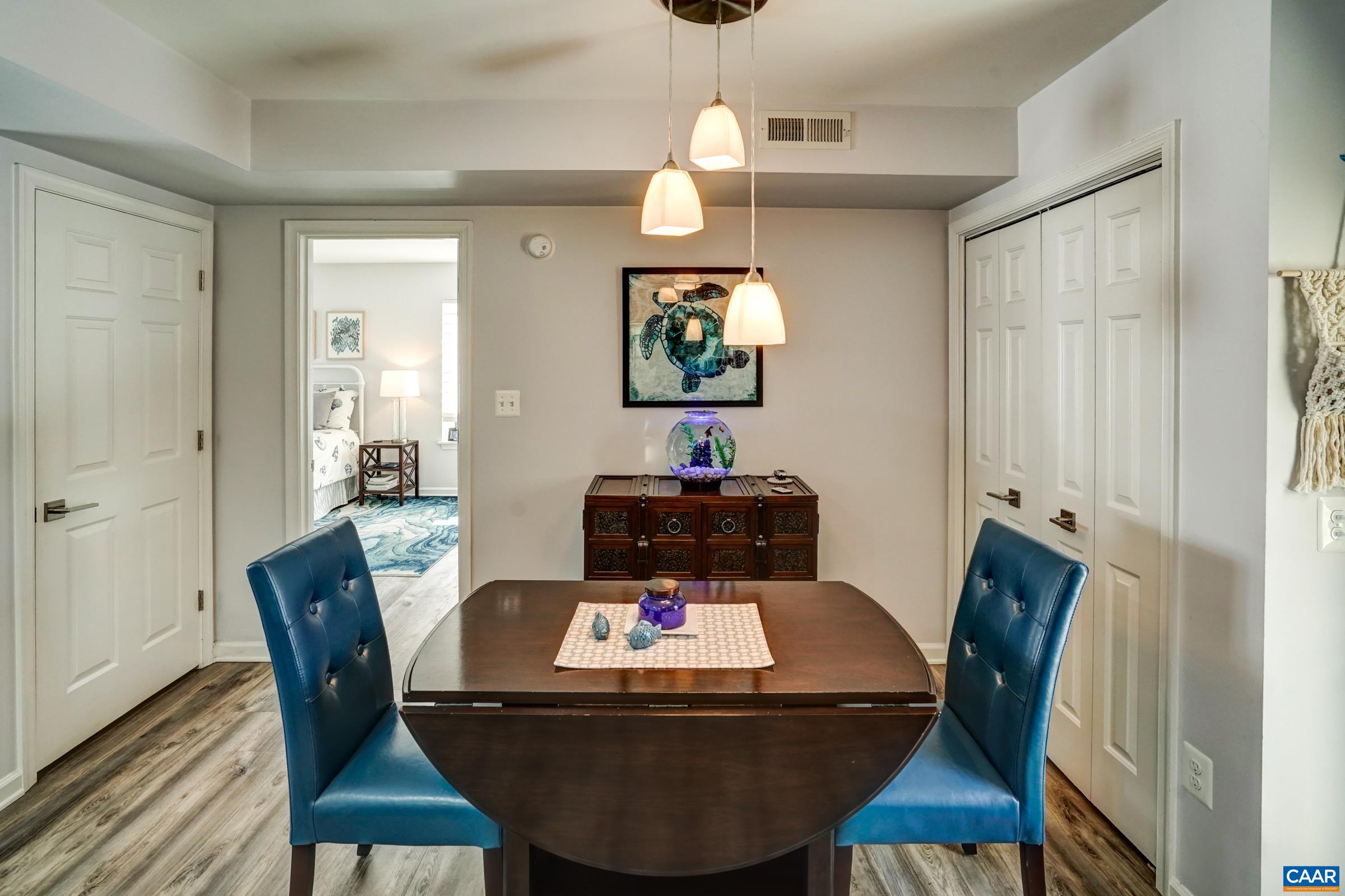 1008 Highlands Drive Charlottesville, VA 22901 - Photo 15 of 41 a view of a dining room with furniture and wooden floor