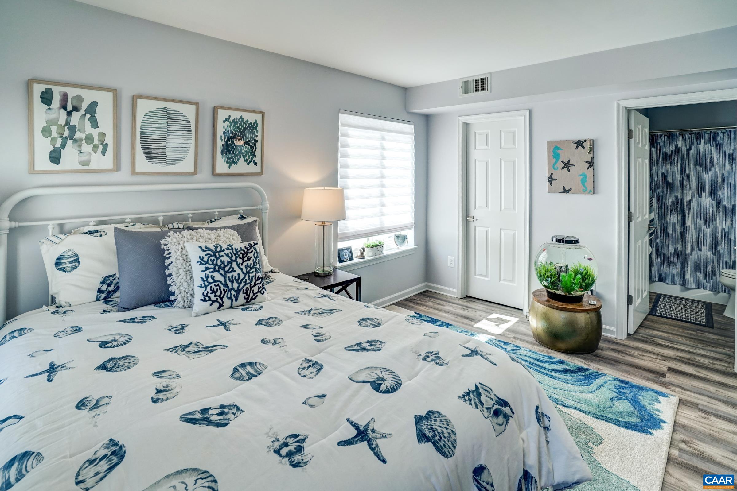 1008 Highlands Drive Charlottesville, VA 22901 - Photo 17 of 41 a bedroom with a bed and wooden floor