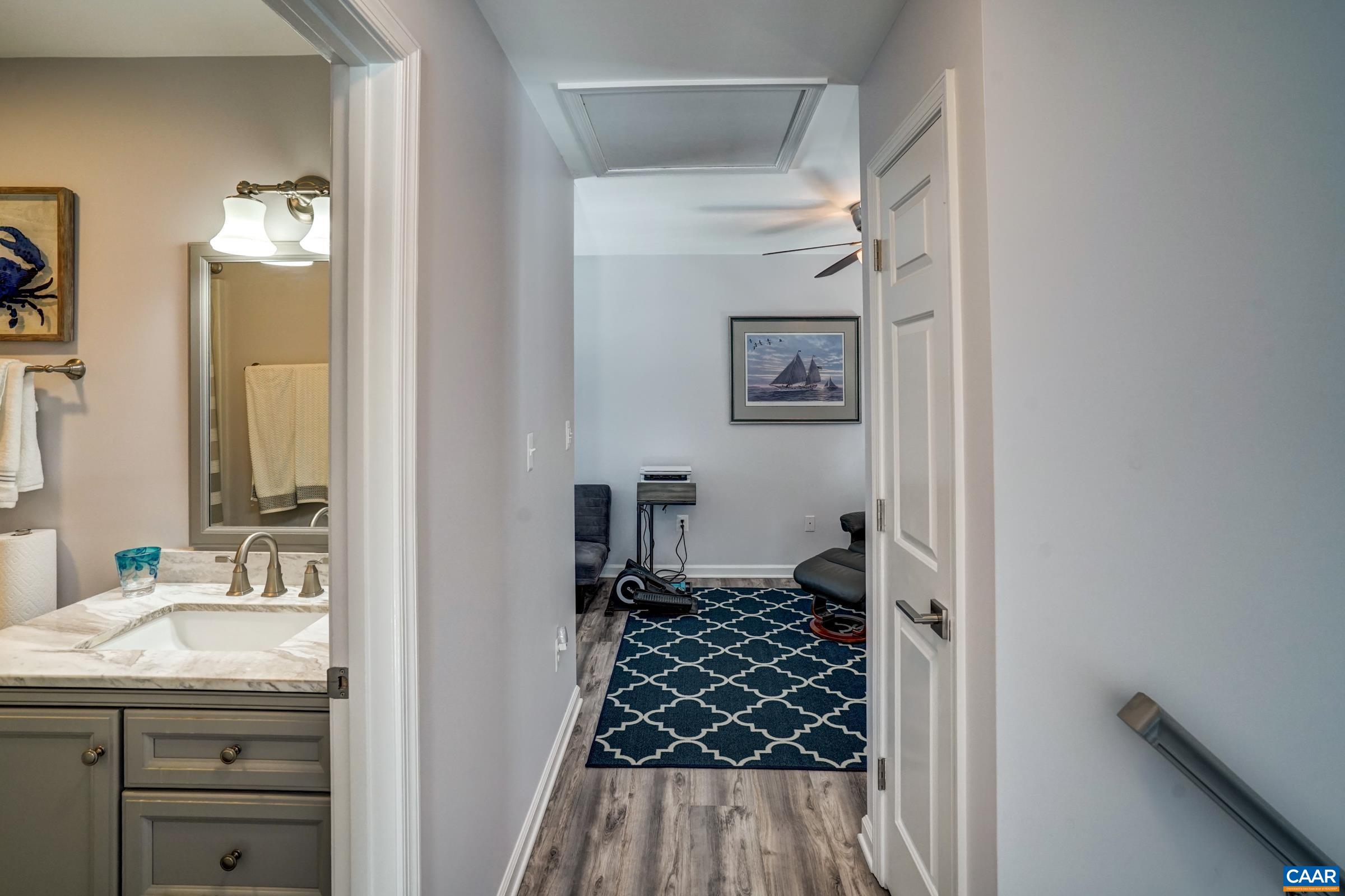 1008 Highlands Drive Charlottesville, VA 22901 - Photo 25 of 41 a bathroom with a granite countertop sink a vanity and a shower