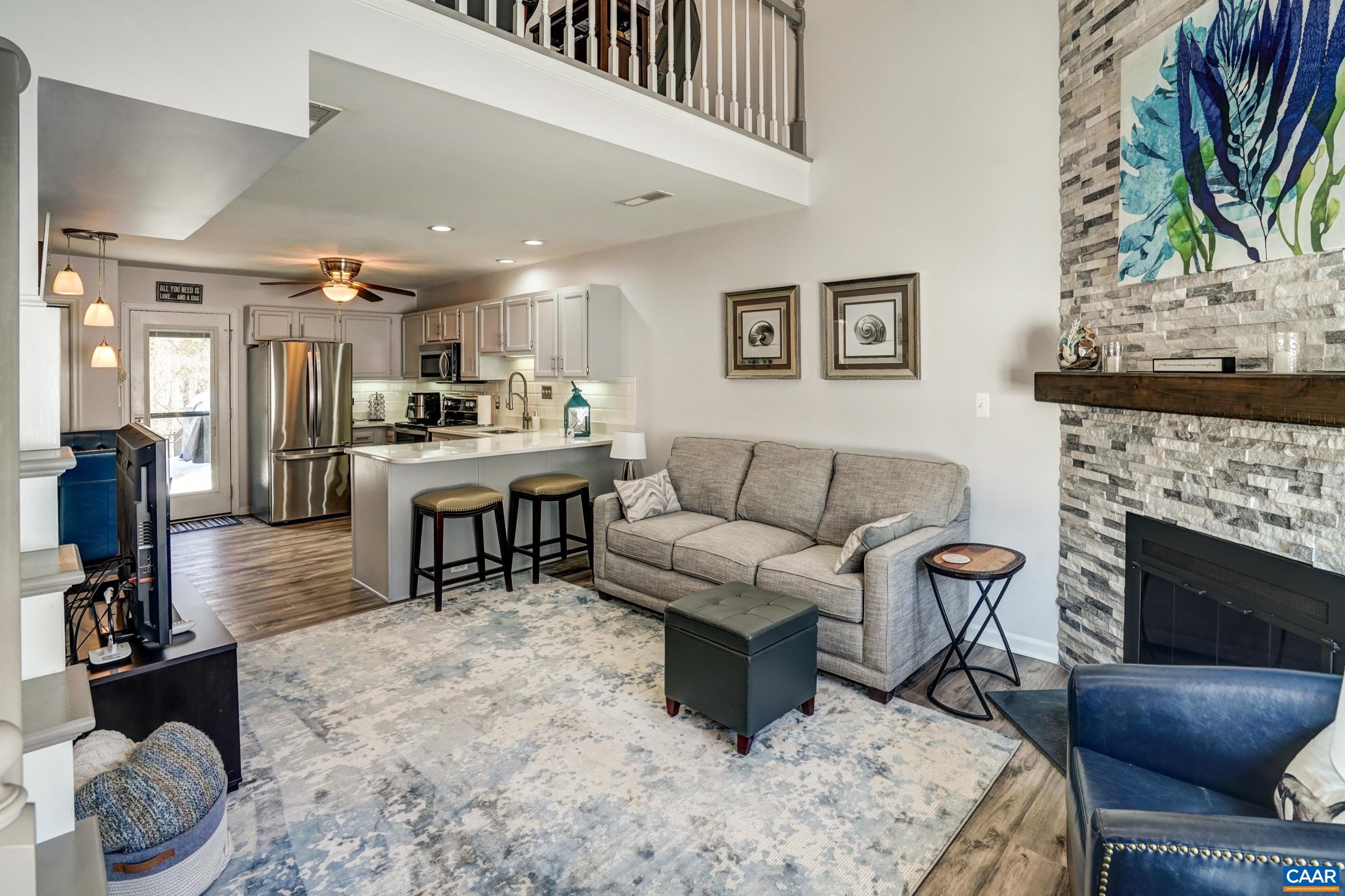 1008 Highlands Drive Charlottesville, VA 22901 - Photo 3 of 41 a living room with furniture and a fireplace