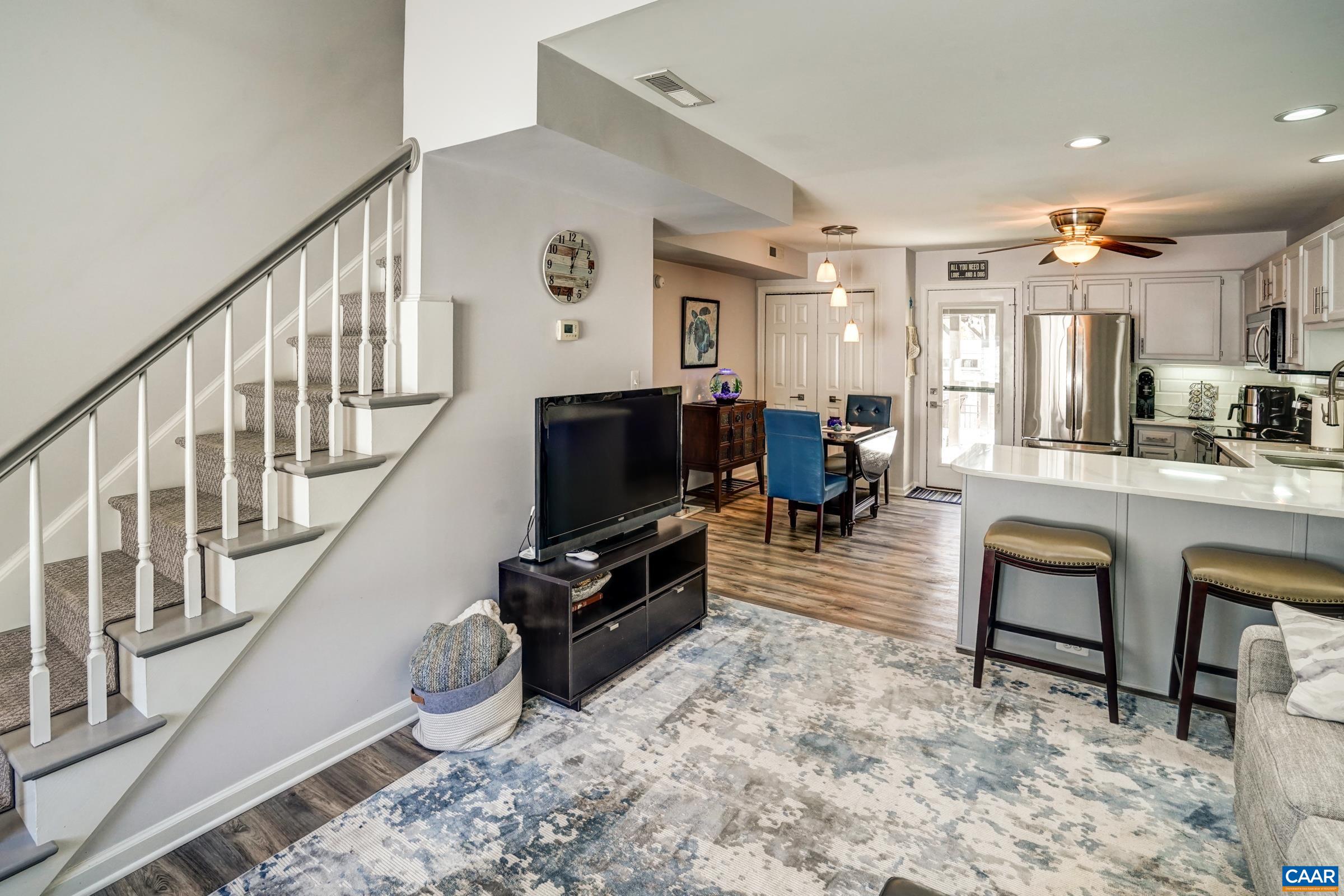 1008 Highlands Drive Charlottesville, VA 22901 - Photo 4 of 41 a living room with furniture and a flat screen tv