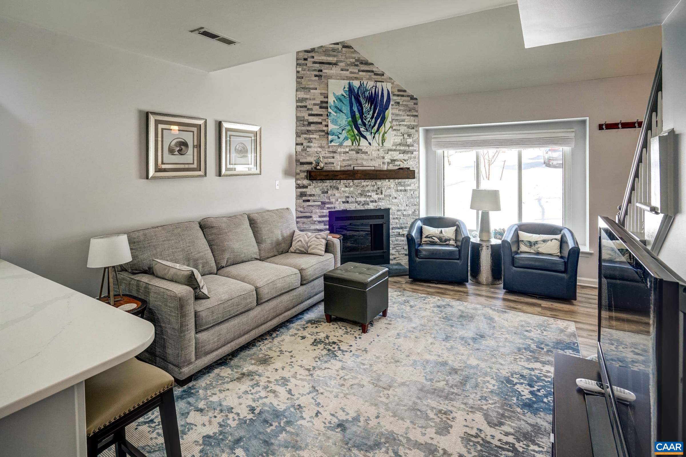 1008 Highlands Drive Charlottesville, VA 22901 - Photo 6 of 41 a living room with furniture fireplace and a large window