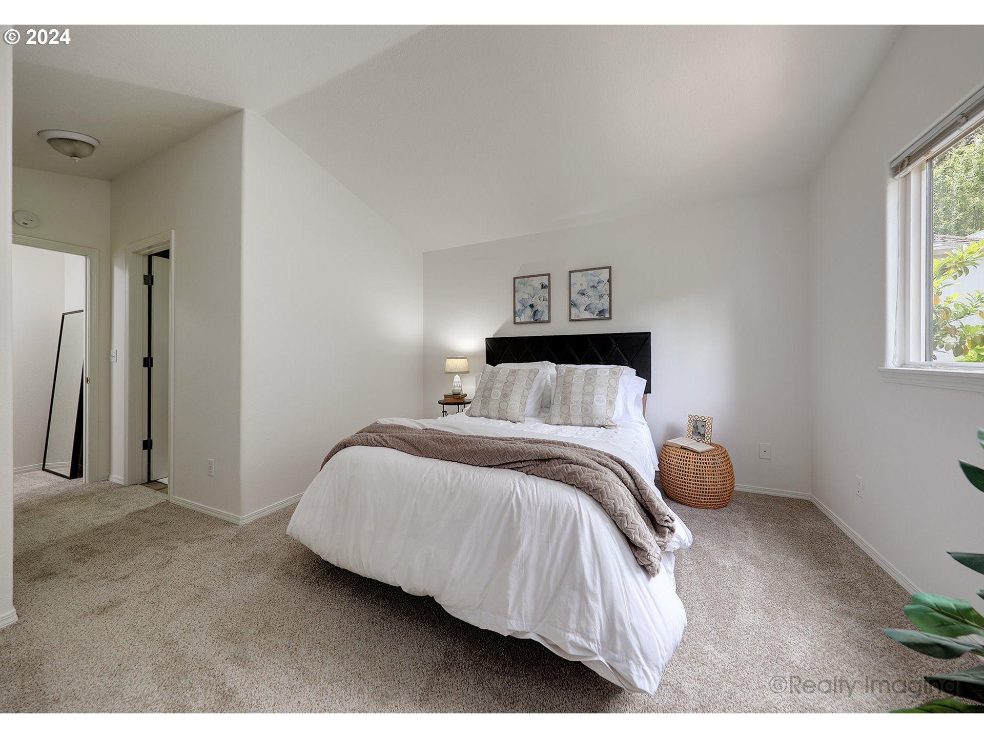 3353 Southwest 174th Avenue Beaverton, OR 97003 - Photo 17 of 33 a bedroom with a bed and a painting on the wall