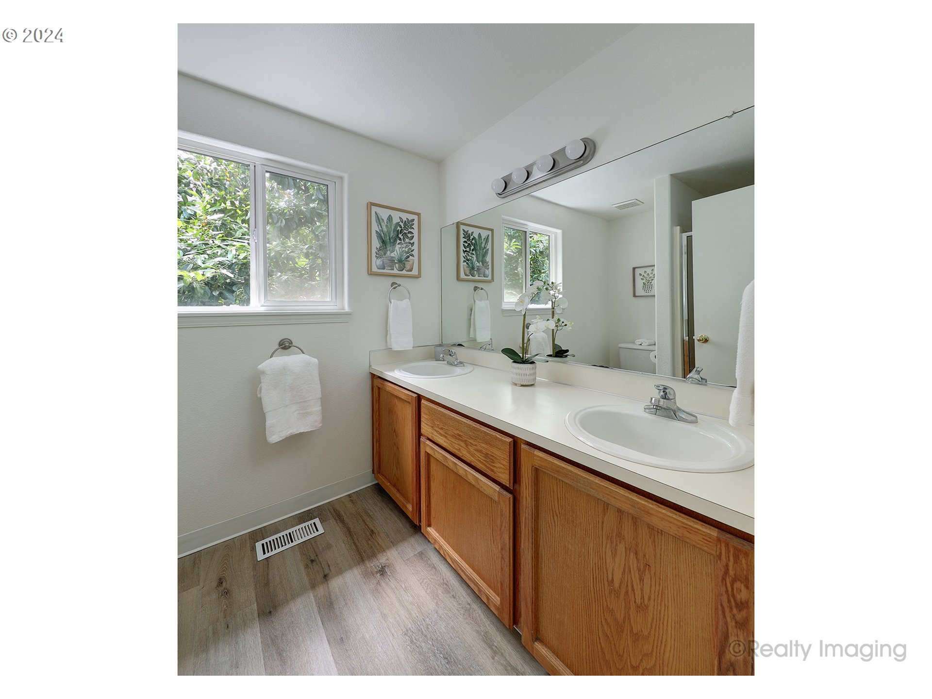 3353 Southwest 174th Avenue Beaverton, OR 97003 - Photo 19 of 33 a bathroom with a sink mirror and a bathtub