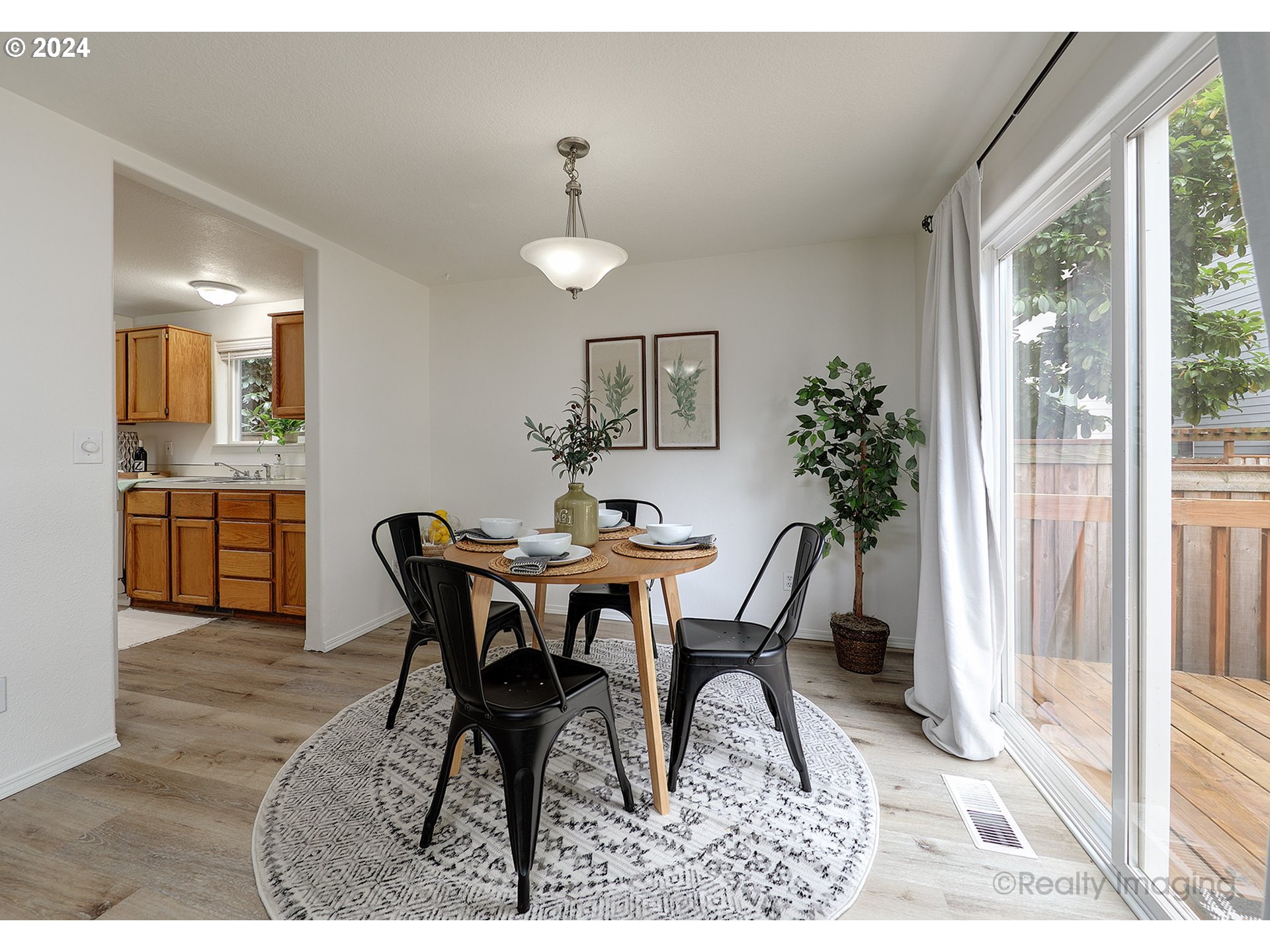 3353 Southwest 174th Avenue Beaverton, OR 97003 - Photo 3 of 33 a view of a dining room with furniture and wooden floor