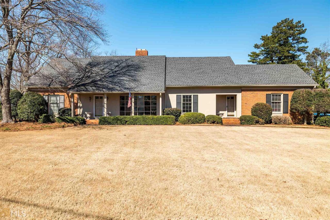 110 Saddle Mountain Road Southeast Rome, GA 30161 - Photo 1 of 1 a front view of a house with a yard