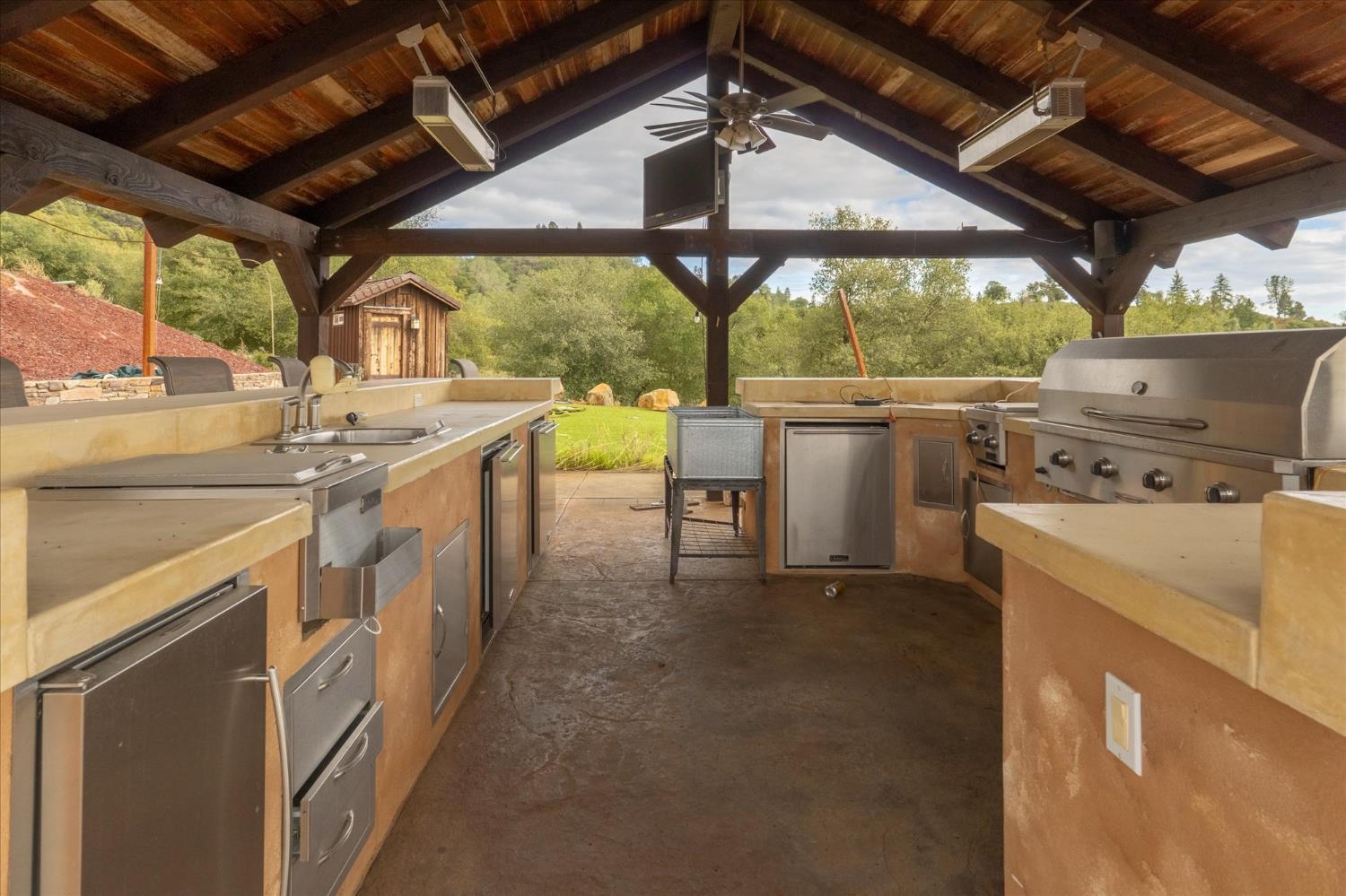 644 Crestview Drive Murphys, CA 95247 - Photo 11 of 56 a kitchen with stainless steel appliances granite countertop a sink a stove and a refrigerator