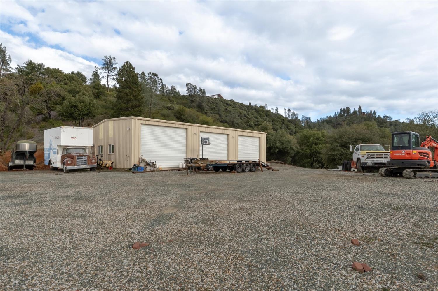 644 Crestview Drive Murphys, CA 95247 - Photo 12 of 56 a view of a house with a truck parked on the road