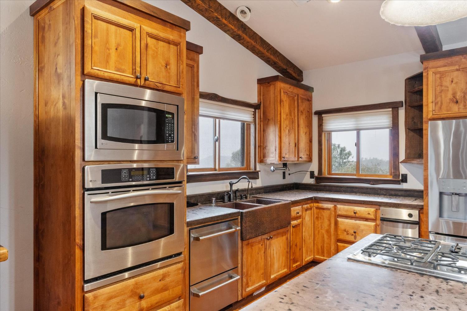 644 Crestview Drive Murphys, CA 95247 - Photo 19 of 56 a kitchen with stainless steel appliances granite countertop a stove and a microwave