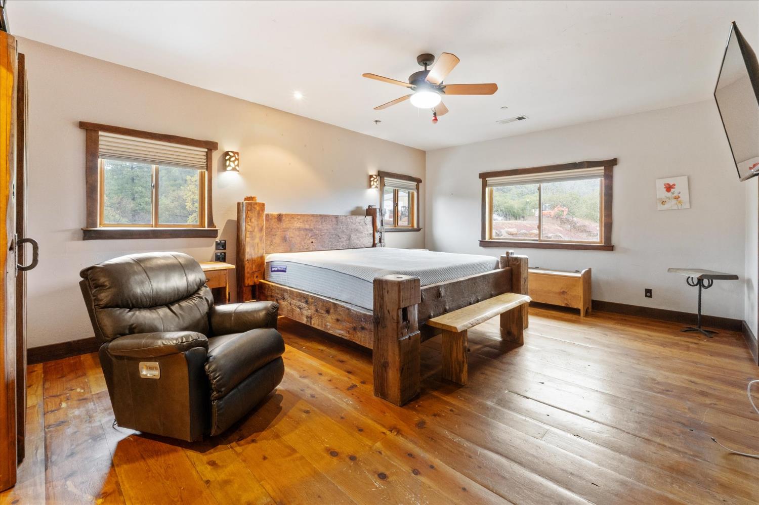 644 Crestview Drive Murphys, CA 95247 - Photo 21 of 56 a spacious bedroom with a bed and window