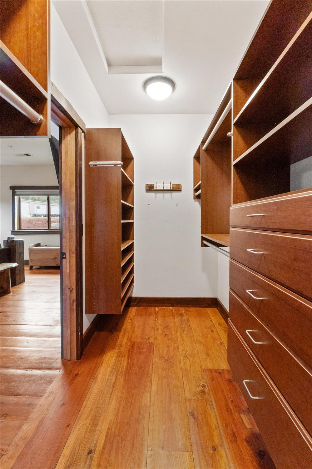644 Crestview Drive Murphys, CA 95247 - Photo 24 of 56 a view of an empty room with wooden floor and a window