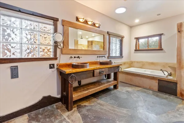 a bathroom with a bath tub and a shower curtain