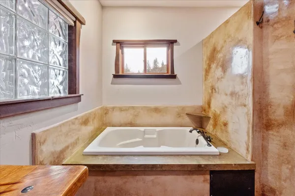 a view of an empty room with glass door