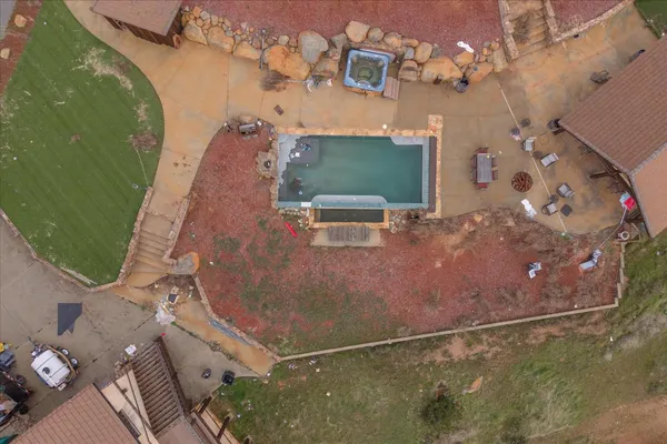an aerial view of a house with outdoor space