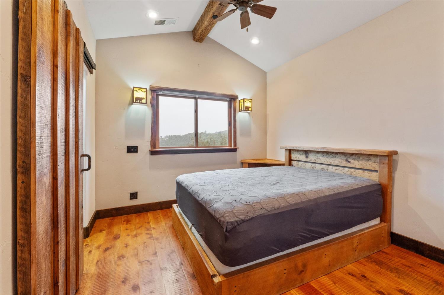 644 Crestview Drive Murphys, CA 95247 - Photo 32 of 56 a bedroom with a bed and window