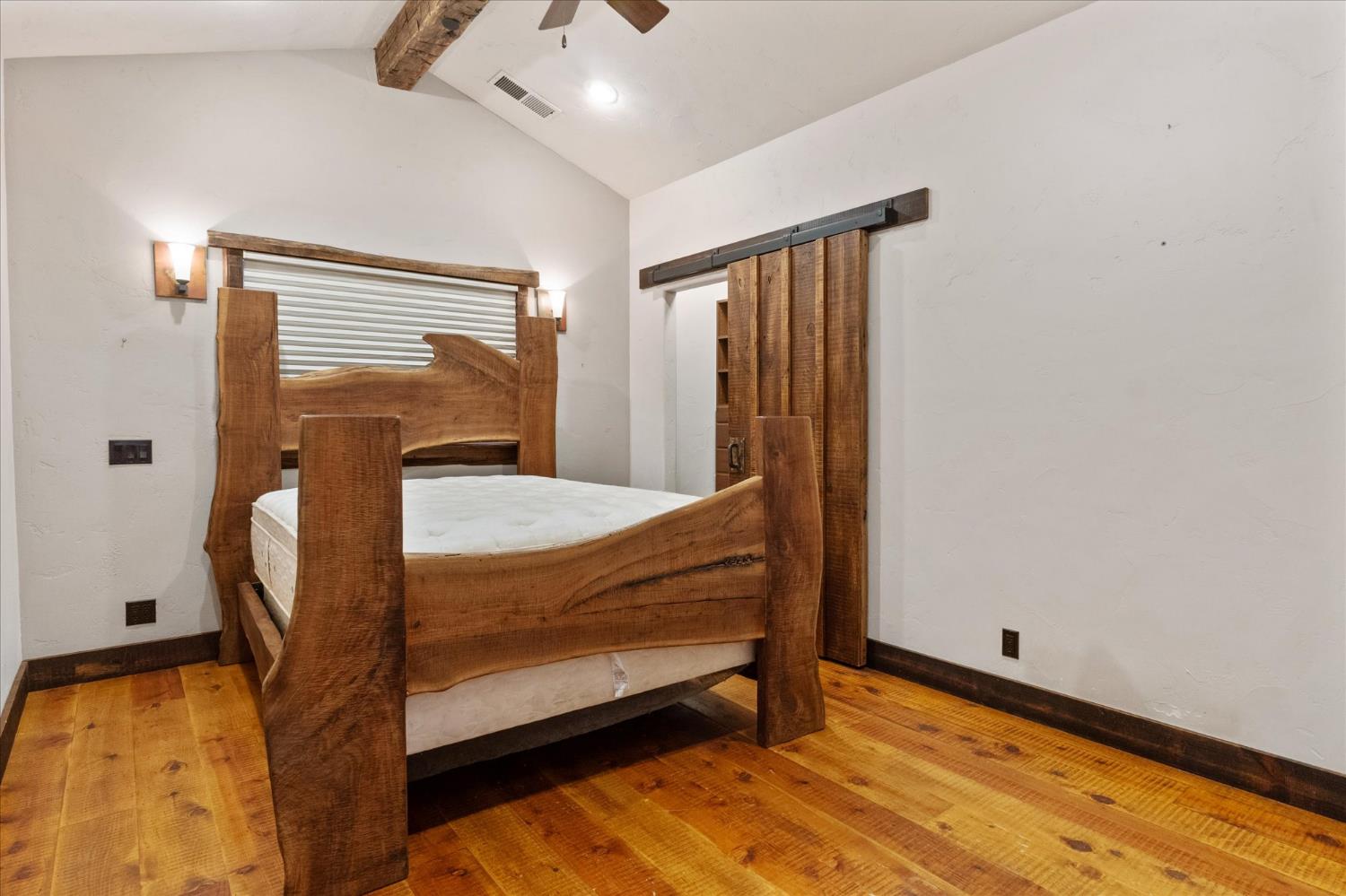 644 Crestview Drive Murphys, CA 95247 - Photo 33 of 56 a bedroom with a bed and wooden floor