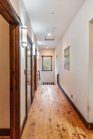 a room with pool table and windows