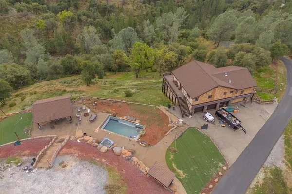 a aerial view of a house with a yard