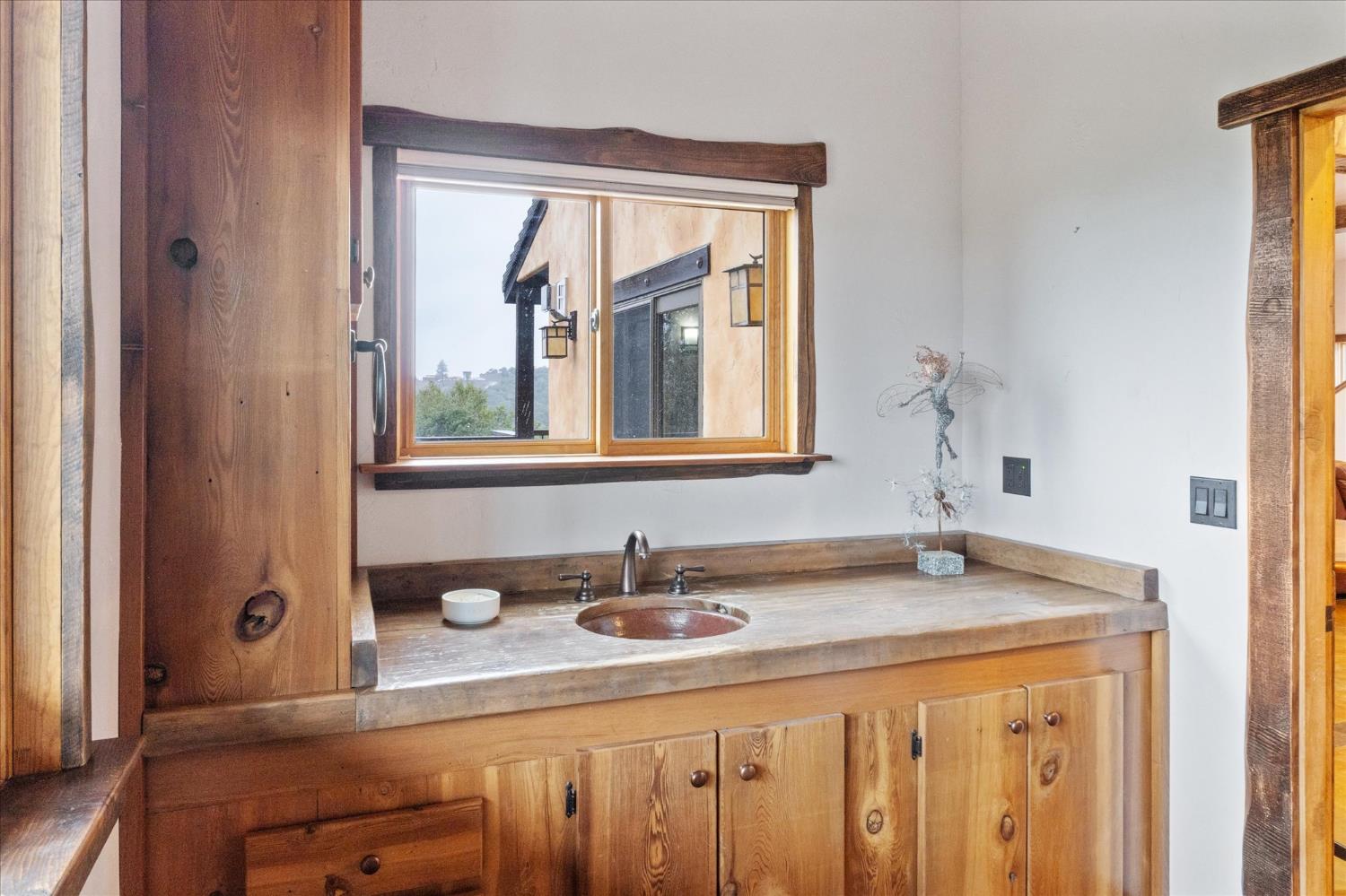 644 Crestview Drive Murphys, CA 95247 - Photo 47 of 56 a bathroom with a sink and a mirror