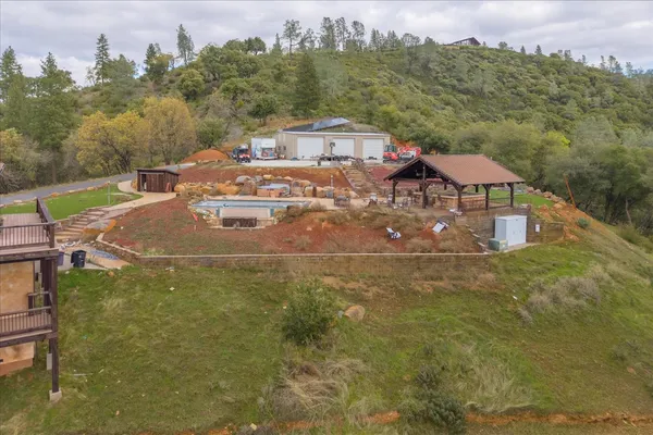 a aerial view of a house with a yard