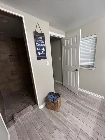 a view of a hallway with entryway