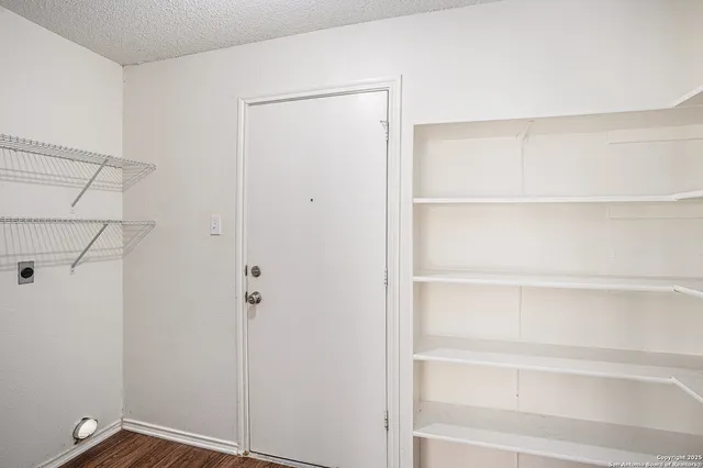 a view of an empty walk in closet
