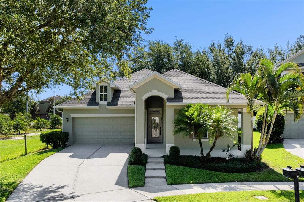 7201 Halton Court Windermere, FL 34786 - Photo 1 of 1 a front view of a house with garden