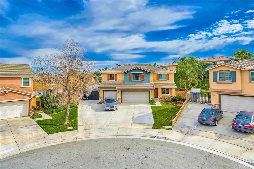 9436 Darby Court Riverside, CA 92508 - Photo 1 of 1 a view of a white house with a yard and plants