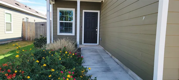 a view of a pathway besides a house