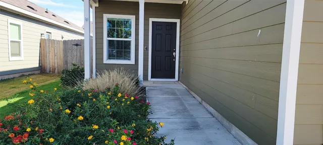 a view of a pathway besides a house