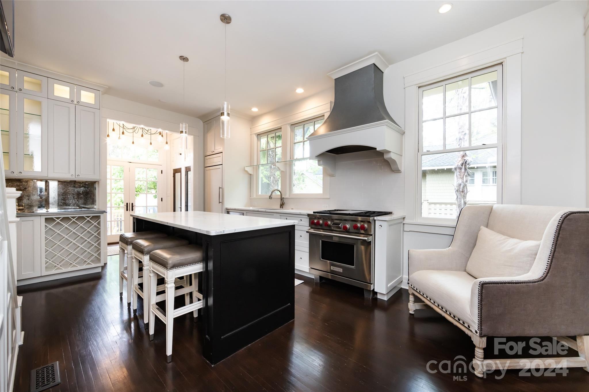 2310 Westfield Road Charlotte, NC 28207 - Photo 15 of 43 a kitchen with granite countertop a stove and a wooden floors