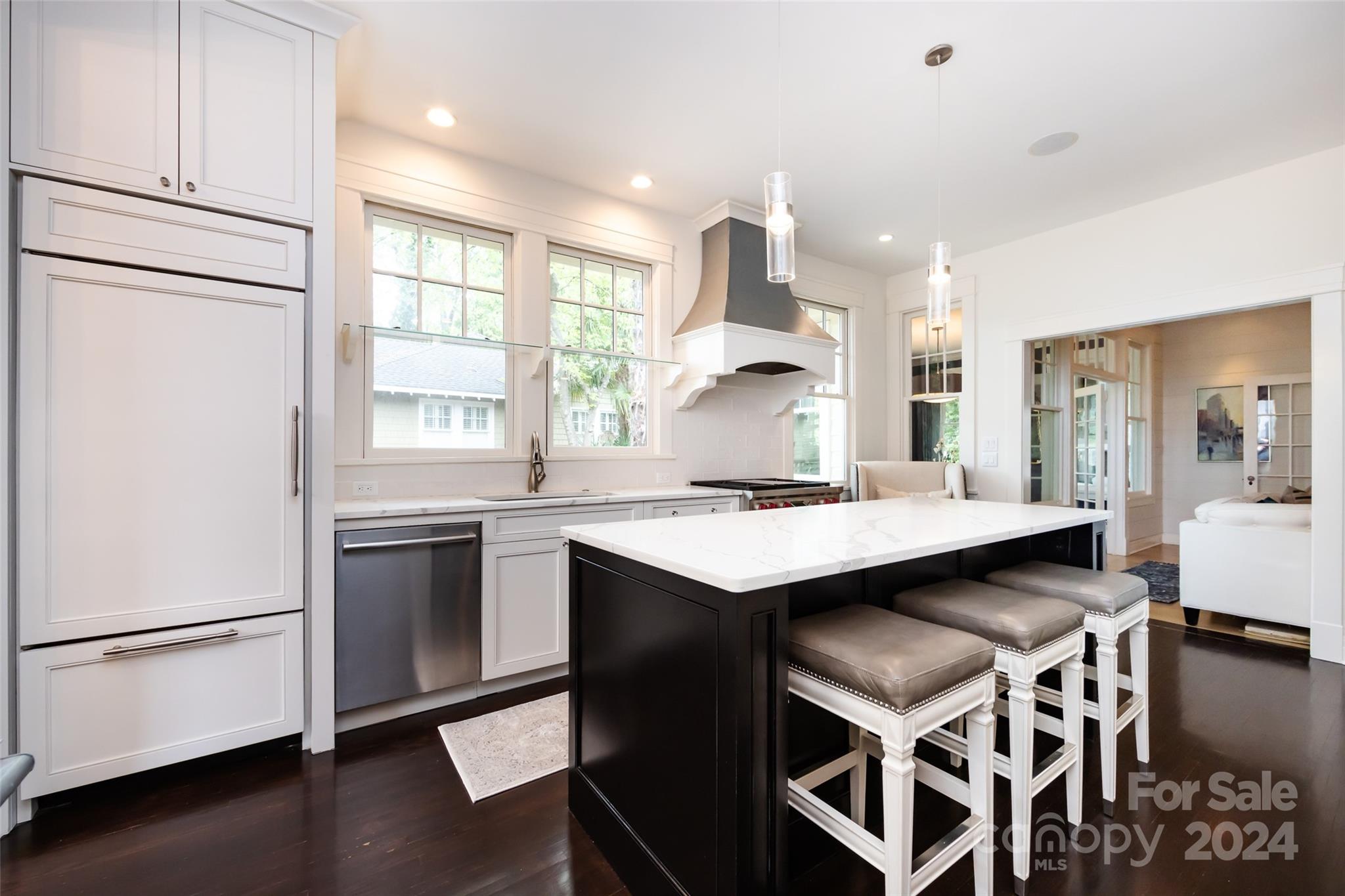 2310 Westfield Road Charlotte, NC 28207 - Photo 16 of 43 a kitchen with stainless steel appliances granite countertop a sink a stove and a refrigerator