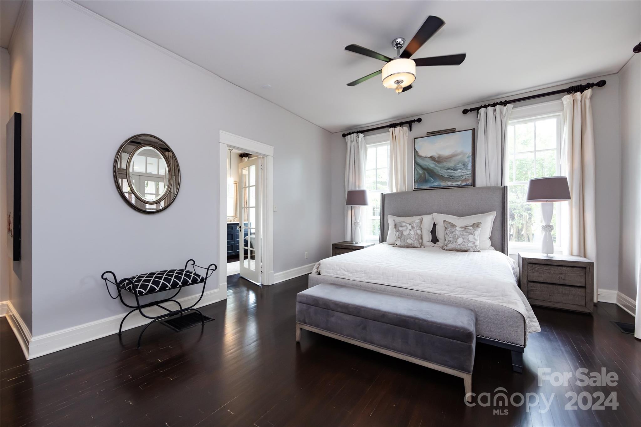 2310 Westfield Road Charlotte, NC 28207 - Photo 19 of 43 a bedroom with a bed and a chandelier